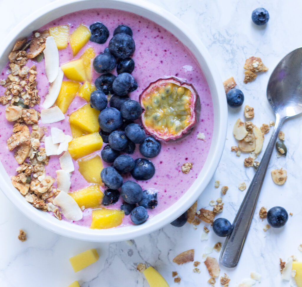 smoothie bowl with mango and berries in mixer Stock Photo - Alamy